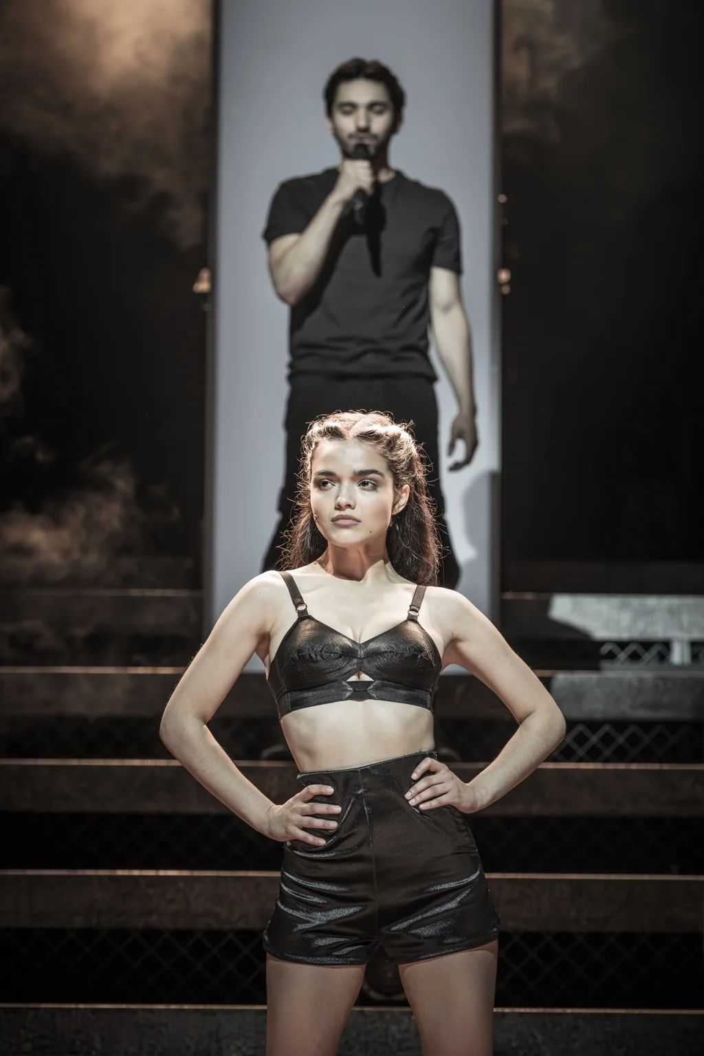 Rachel Zegler as Eva Perón stands in the foreground with Diego Andres Rodriguez as Che behind her.