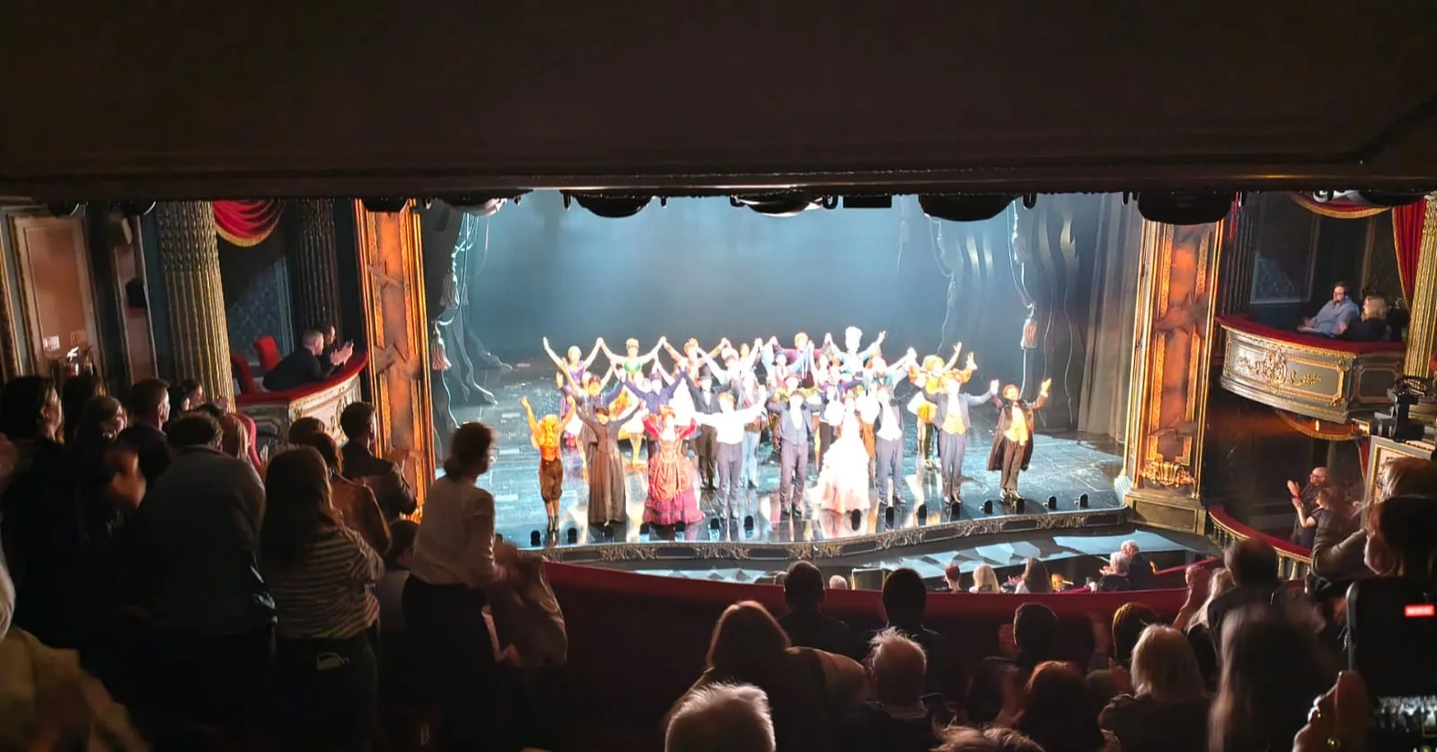 The Phantom of the Opera company taking a curtain call on stage at His Majesty's Theatre